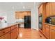 Bright eat-in kitchen offering built-in desk space, stainless steel appliances, and wood floors at 3688 Eagles Beek Cir, Lithonia, GA 30038