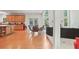 Bright and airy kitchen with hardwood floors, casual dining area, and seamless transition to the living room at 3688 Eagles Beek Cir, Lithonia, GA 30038