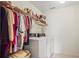 This laundry room has lots of hanging storage, as well as a washer and dryer at 3688 Eagles Beek Cir, Lithonia, GA 30038