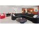 Open-concept living space with modern furnishings and seamless flow to the kitchen, ideal for entertaining at 3688 Eagles Beek Cir, Lithonia, GA 30038