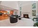 Spacious living room with fireplace, abundant natural light, and open layout to the kitchen for seamless living at 3688 Eagles Beek Cir, Lithonia, GA 30038