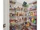 Walk-in pantry with metal shelving containing many boxed and canned goods at 3688 Eagles Beek Cir, Lithonia, GA 30038