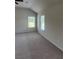 This carpeted bedroom features many large windows with light streaming in at 1857 Kingsmere Run Dr, Loganville, GA 30052