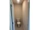 Powder room features a toilet and neutral walls plus a door at 1857 Kingsmere Run Dr, Loganville, GA 30052
