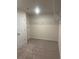 This walk-in closet has carpet and wire shelving for storage at 1857 Kingsmere Run Dr, Loganville, GA 30052