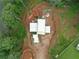 Aerial view showcasing the home's unique layout, nestled amid lush trees and verdant greenery, offering peaceful seclusion at 5210 Brownlee Rd, Stone Mountain, GA 30087