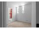 Bright bathroom space with prepped walls and three vertically stacked windows offering natural light at 5210 Brownlee Rd, Stone Mountain, GA 30087