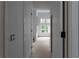 Hallway view showcasing the home's open layout and natural light from the adjacent living area at 5210 Brownlee Rd, Stone Mountain, GA 30087