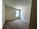Small bedroom with neutral carpet and walls at 1909 Victoria Way # 116, Conyers, GA 30013