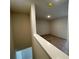Upstairs hallway landing leading to rooms with carpet at 1909 Victoria Way # 116, Conyers, GA 30013