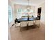 Well-lit dining room featuring a modern chandelier and stylish furniture at 410 Anglin Walk, Alpharetta, GA 30009