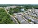 Aerial view of townhomes with a pond, showcasing a well-planned community with nature and modern living at 1190 Buice Lake Pkwy, Acworth, GA 30102