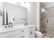 Modern bathroom with double sink vanity, matte black hardware, and tiled glass walk-in shower at 1190 Buice Lake Pkwy, Acworth, GA 30102