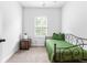 Cozy bedroom with twin bed, soft carpet, and large window that offers natural light at 1190 Buice Lake Pkwy, Acworth, GA 30102