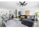 Cozy living room with hardwood floors, ceiling fan, and open access to kitchen at 1190 Buice Lake Pkwy, Acworth, GA 30102