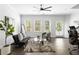 Bright living room with contemporary decor, hardwood floors, and a ceiling fan at 1190 Buice Lake Pkwy, Acworth, GA 30102