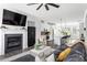 Open-concept living room flows into modern kitchen, featuring a fireplace and comfortable seating at 1190 Buice Lake Pkwy, Acworth, GA 30102
