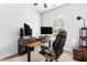 Office space with modern desk, ergonomic chair, and dual monitors, offering an ideal workspace at 1190 Buice Lake Pkwy, Acworth, GA 30102