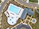 Aerial view of a community pool area, featuring a large pool, kiddie pool, and lounge area at 1190 Buice Lake Pkwy, Acworth, GA 30102