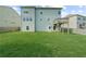 Large fenced-in backyard with lush green grass and a small deck for entertaining at 5345 Mirror Lake Dr, Cumming, GA 30028
