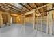 Unfinished basement with exposed wooden frame, providing potential for customization at 5345 Mirror Lake Dr, Cumming, GA 30028