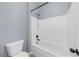 Bathroom featuring a shower and a modern toilet at 5345 Mirror Lake Dr, Cumming, GA 30028