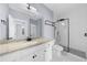 Modern bathroom featuring a granite countertop, white cabinets, and glass shower at 5345 Mirror Lake Dr, Cumming, GA 30028