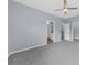 Bedroom with multiple access doors and plush carpeting at 5345 Mirror Lake Dr, Cumming, GA 30028