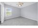 A cozy bedroom with a ceiling fan and natural light at 5345 Mirror Lake Dr, Cumming, GA 30028