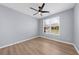 Serene bedroom with modern ceiling fan and natural light at 5345 Mirror Lake Dr, Cumming, GA 30028