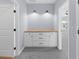Hallway features white cabinets with black hardware and a wood countertop with two overhead lights at 5345 Mirror Lake Dr, Cumming, GA 30028