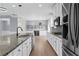 Well appointed kitchen features granite counters, stainless appliances, and island seating at 5345 Mirror Lake Dr, Cumming, GA 30028