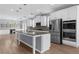 Beautiful kitchen with granite counters, stainless appliances, and custom lighting at 5345 Mirror Lake Dr, Cumming, GA 30028