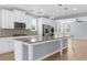 Kitchen with granite countertops, stainless steel appliances, and white cabinets at 5345 Mirror Lake Dr, Cumming, GA 30028