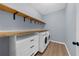 A functional laundry room featuring modern washer and dryer at 5345 Mirror Lake Dr, Cumming, GA 30028