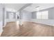 Inviting open-concept living room featuring pristine floors, light walls, and natural light at 5345 Mirror Lake Dr, Cumming, GA 30028