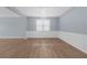 Bright living room featuring lovely floors, soft walls, and elegant trim at 5345 Mirror Lake Dr, Cumming, GA 30028