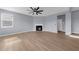 Spacious living room featuring a fireplace and light wood flooring, perfect for entertaining at 5345 Mirror Lake Dr, Cumming, GA 30028