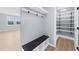 Functional mudroom area complete with bench, coat hooks, and access to a spacious walk-in pantry at 5345 Mirror Lake Dr, Cumming, GA 30028