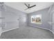 Large walk in closet with carpet flooring, an open layout, and built in shelving for storage at 5345 Mirror Lake Dr, Cumming, GA 30028