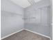Spacious walk-in closet with metal shelving and neutral carpet, offering ample storage space at 5345 Mirror Lake Dr, Cumming, GA 30028
