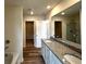 Bathroom featuring double sinks, granite countertops, and shower at 1911 Victoria Way # 117, Conyers, GA 30013