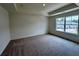 This bedroom has carpet flooring and a bright window view at 1911 Victoria Way # 117, Conyers, GA 30013