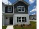 Charming two-story home with a brick facade, complemented by a well-maintained lawn and appealing architectural details at 1911 Victoria Way # 117, Conyers, GA 30013