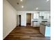 Bright living area featuring modern flooring, ample natural light, and open access to the kitchen space at 1911 Victoria Way # 117, Conyers, GA 30013