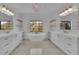 Luxurious bathroom features double vanity, soaking tub, and modern fixtures at 2875 Caney Parc Way, Cumming, GA 30041