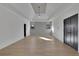 Bright bedroom with hardwood floors, tray ceiling, modern fan, and dual closets at 2875 Caney Parc Way, Cumming, GA 30041