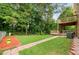 Well-maintained backyard with a walkway and tiered deck at 3049 Heathgate Ct, Lawrenceville, GA 30044