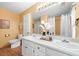 Bathroom with double vanity, neutral paint, and white cabinets at 3049 Heathgate Ct, Lawrenceville, GA 30044