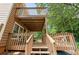 Stacked wooden decks and stairs offering outdoor living and views at 3049 Heathgate Ct, Lawrenceville, GA 30044
